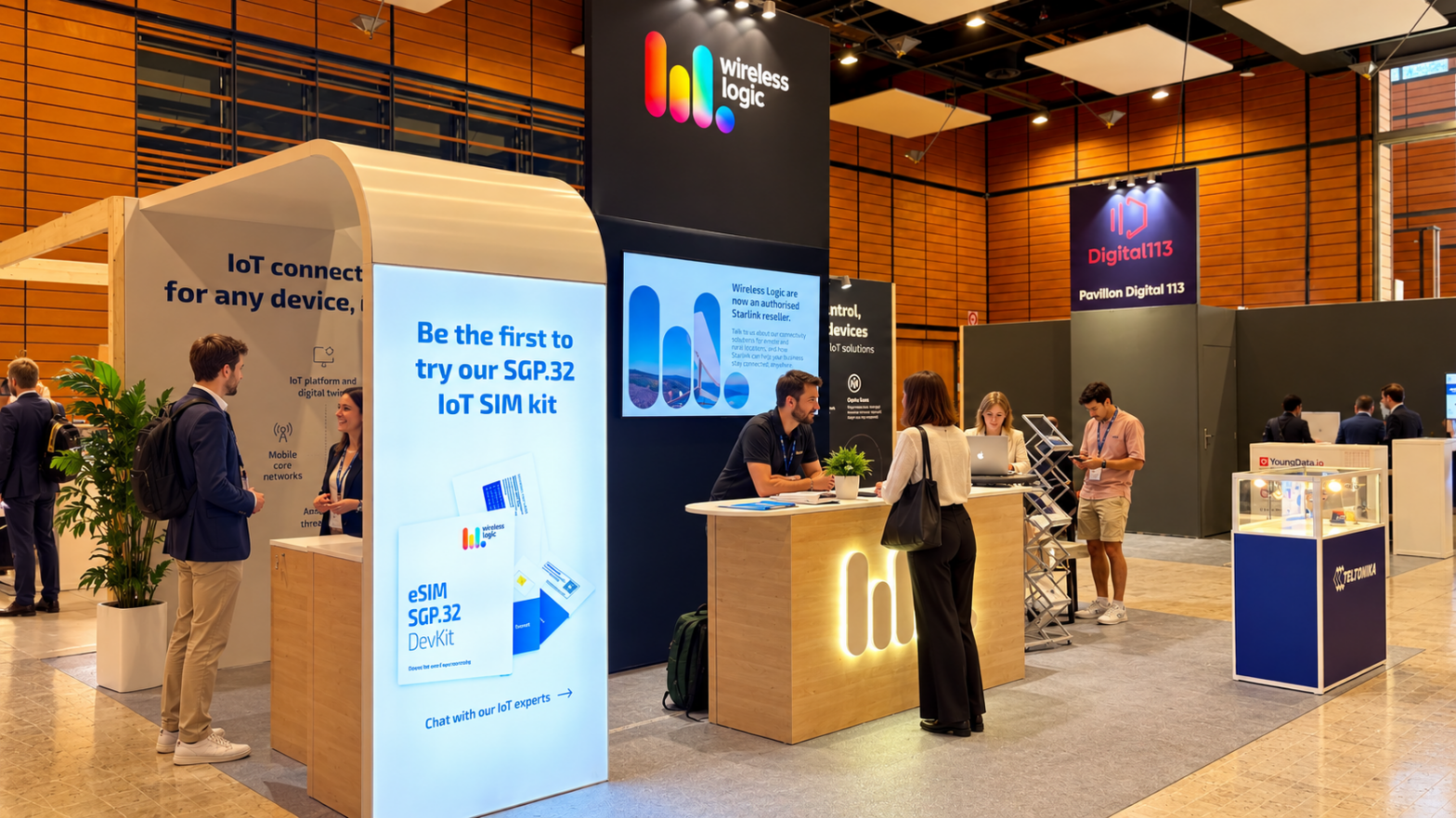 Stand Wireless Logic au SIDO Lyon 2026 — comptoir bois éclairé, totem éclairé et écran grand format à la Cité Internationale
